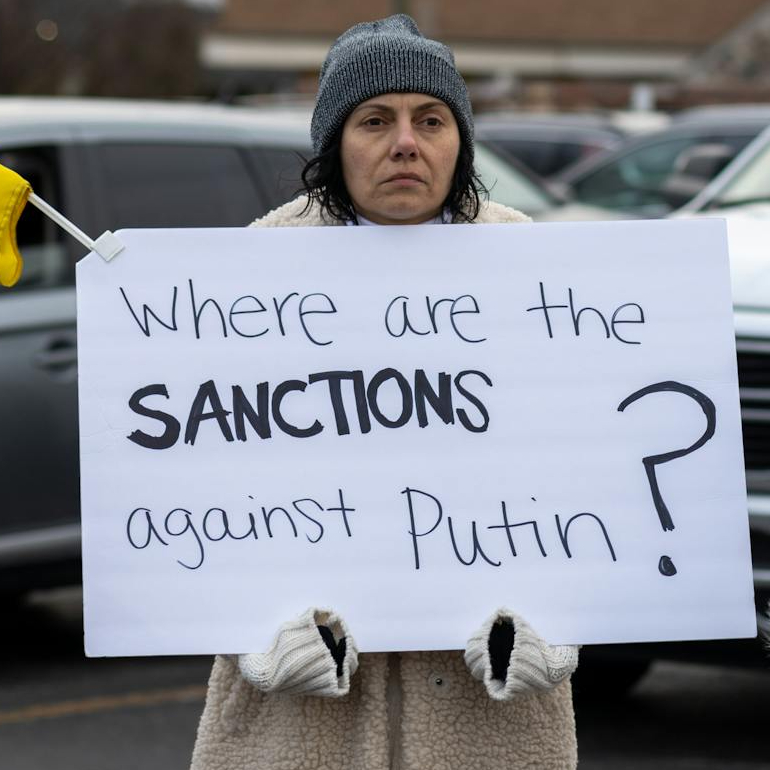 women with placards and flag of ukraine